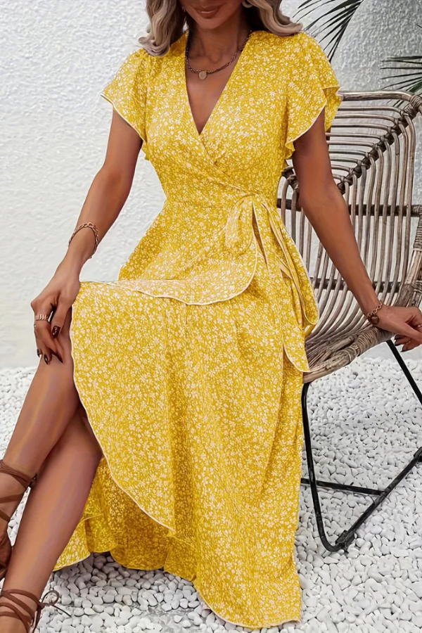 Women's summer V-neck floral dress, flowing midi length, perfect for warm days.