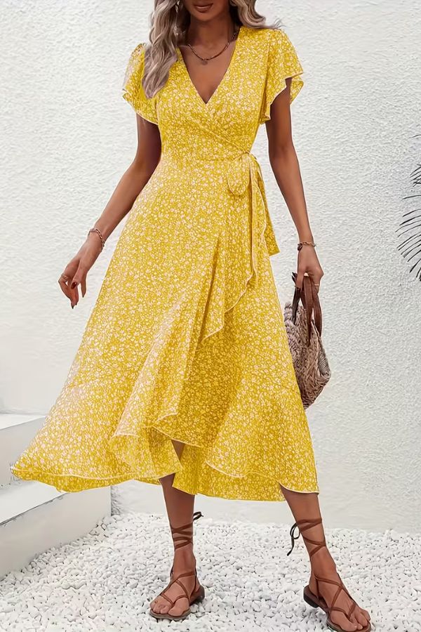 Back view of a women's V-neck floral dress, highlighting its elegant silhouette.