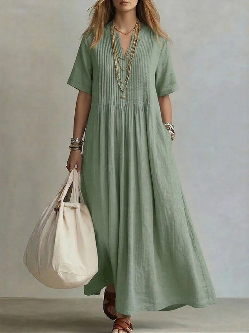 Women's elegant V-neck midi dress, flowy vibrant style. Perfect for summer occasions, comfortable & flattering.