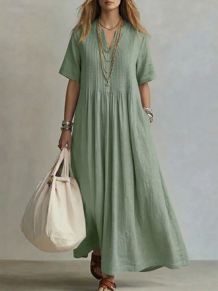 Women's elegant V-neck midi dress, flowy vibrant style. Perfect for summer occasions, comfortable & flattering.