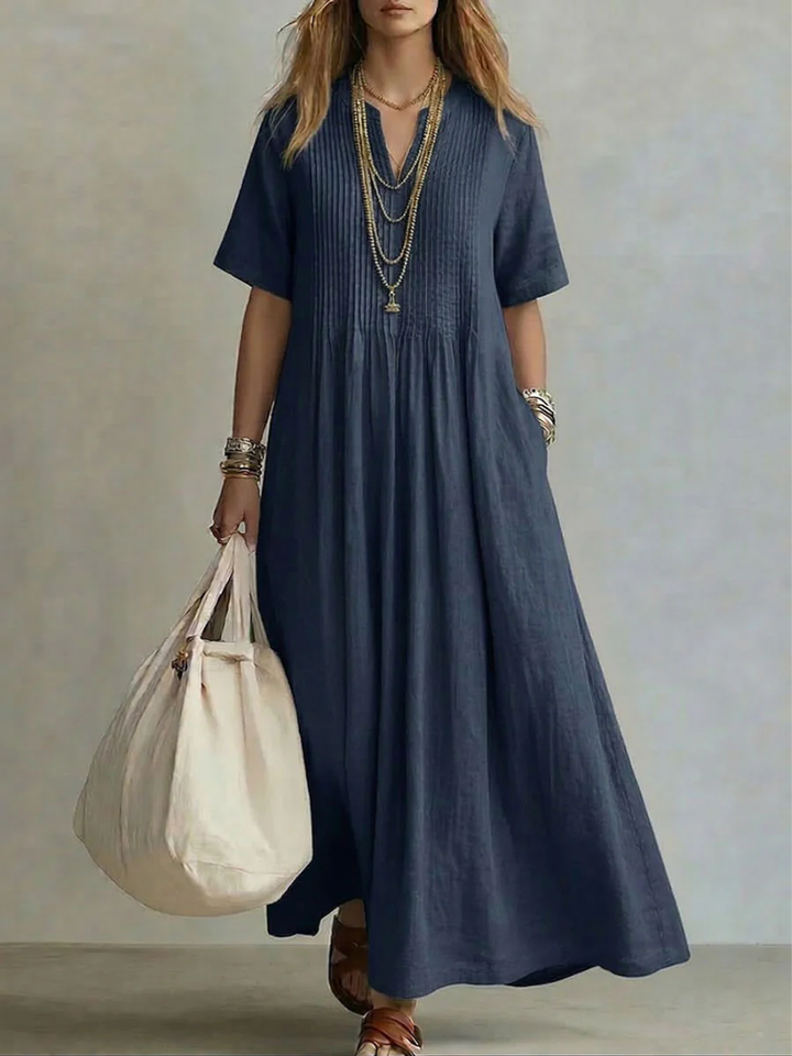 Comfortable women's V-neck midi dress with a flattering flowy fit. Elegant, vibrant style, ideal for summer fashion.