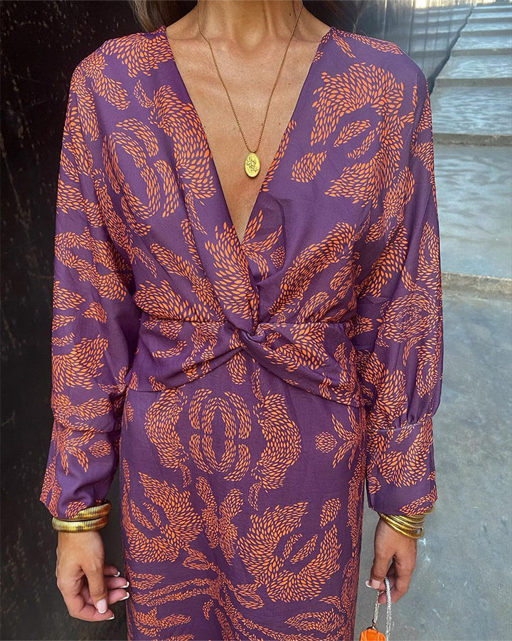 Premium women's long sleeve midi dress featuring an elegant V-neck and a chic knot design, occasion wear.