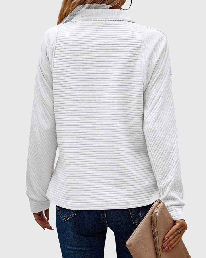Elegant women's V-neck sweater with a chic zipper, offering versatile styling. Comfortable knitwear for fashion.