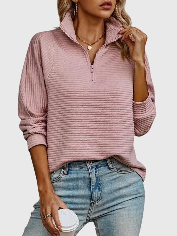 Comfortable women's knit sweater featuring an elegant V-neck and zipper. Perfect for stylish, versatile fashion.