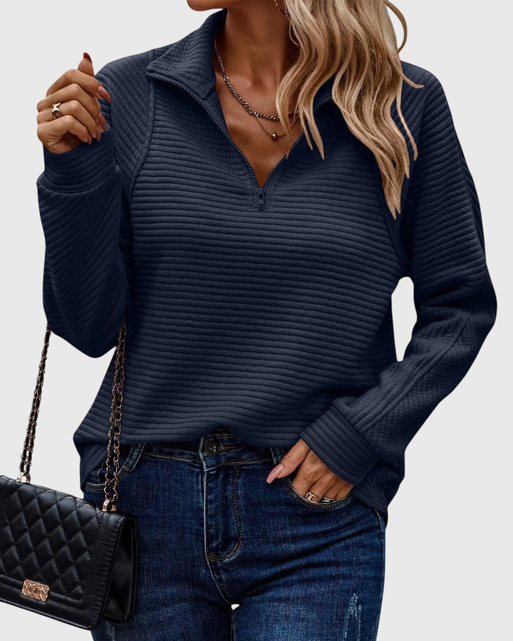 Chic women's V-neck sweater with a zipper detail. Elegant knitwear for a stylish, versatile, and comfortable look.