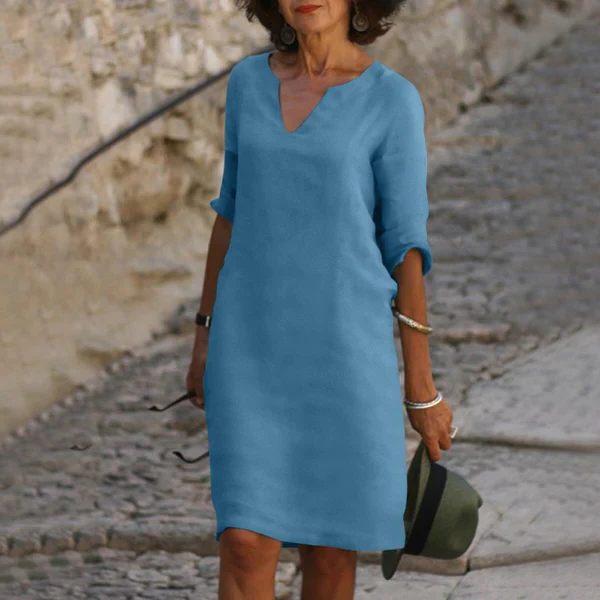 Women's elegant V-neck three-quarter sleeve midi dress, perfect for spring/summer comfort and style.