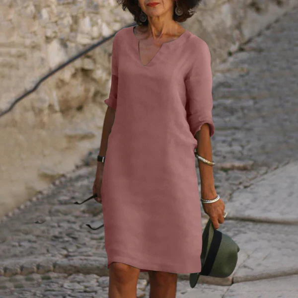 Versatile women's V-neck dress, 3/4 sleeves, flattering midi length for spring and summer events.