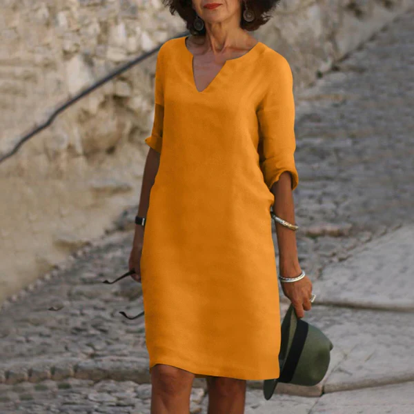 Everyday style women's V-neck midi dress with three-quarter sleeves, combining elegance & comfort.