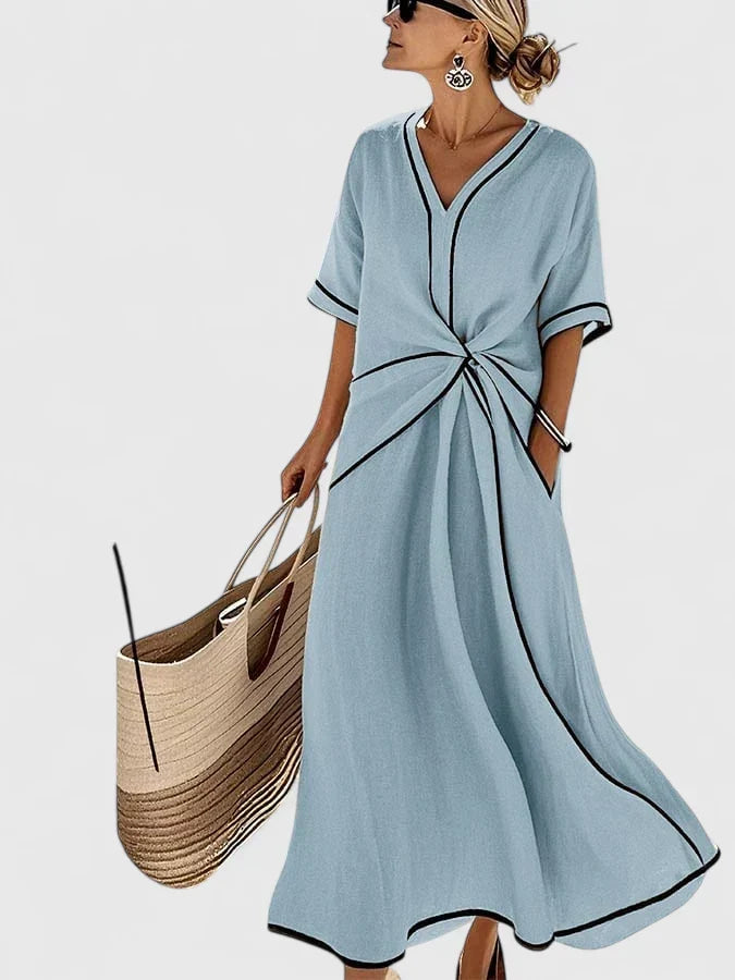 Relaxed fit women's vertical stripe summer midi dress, perfect for beach days or casual elegant warm weather.