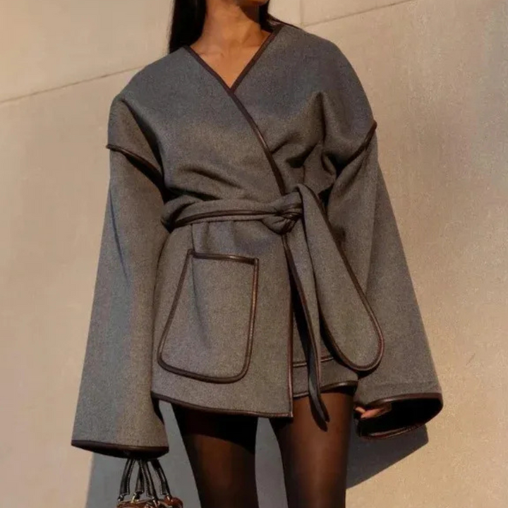 Classic gray women's long winter coat, elegant & warm. Versatile fashion outerwear, ideal for cold weather style.