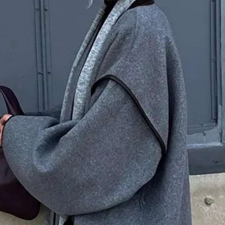 Versatile gray women's long winter coat, classic elegant style. Warm fashion outerwear for chilly seasonal weather.