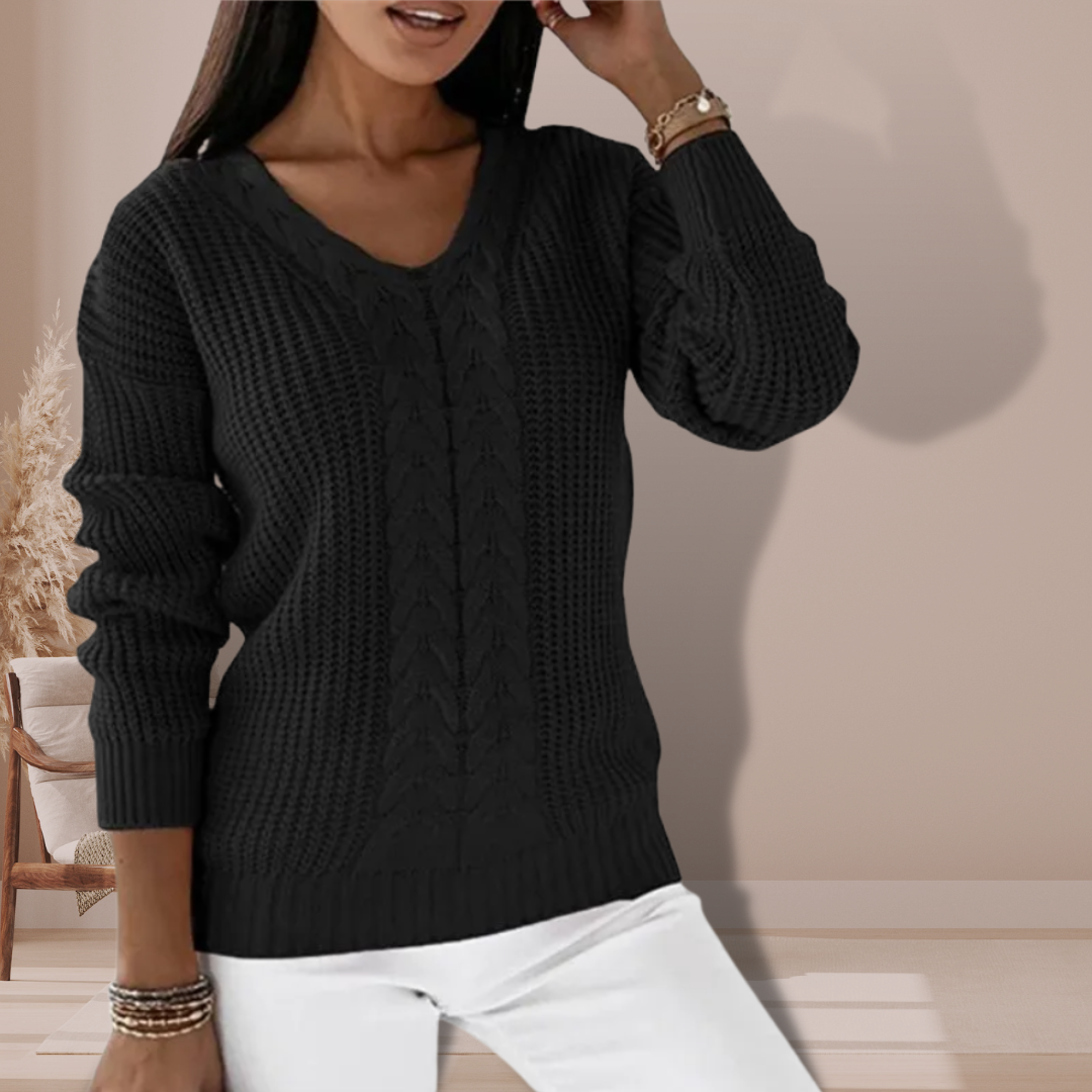 Fashionable women's warm pullover sweater. Stay stylish and cozy this winter with this elegant long sleeve top.