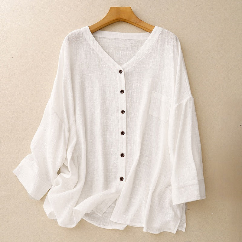 Women's elegant white button-up shirt, chic and relaxed fit for versatile spring and everyday fashion.
