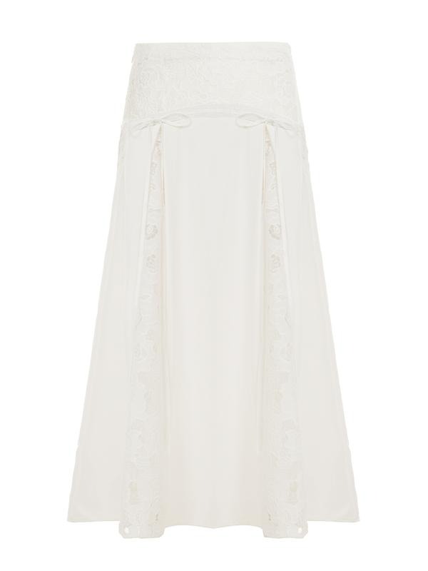 Boho chic women's white maxi skirt with elegant lace panels, a versatile piece for summer and beyond.