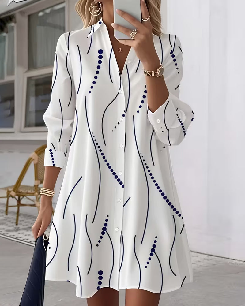 White women's maxi dress with an elegant, natural leafy print. Comfortable and stylish for a chic look.