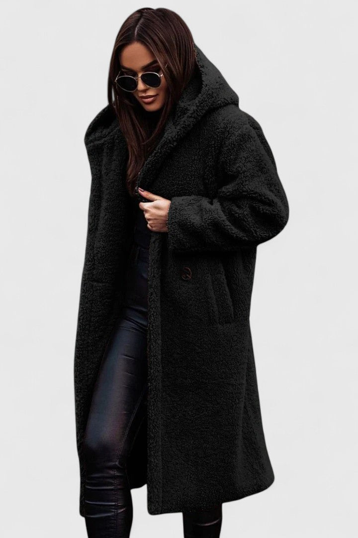 Elegant women's warm winter coat in a stylish design. Chic outerwear for cold weather fashion and comfort.