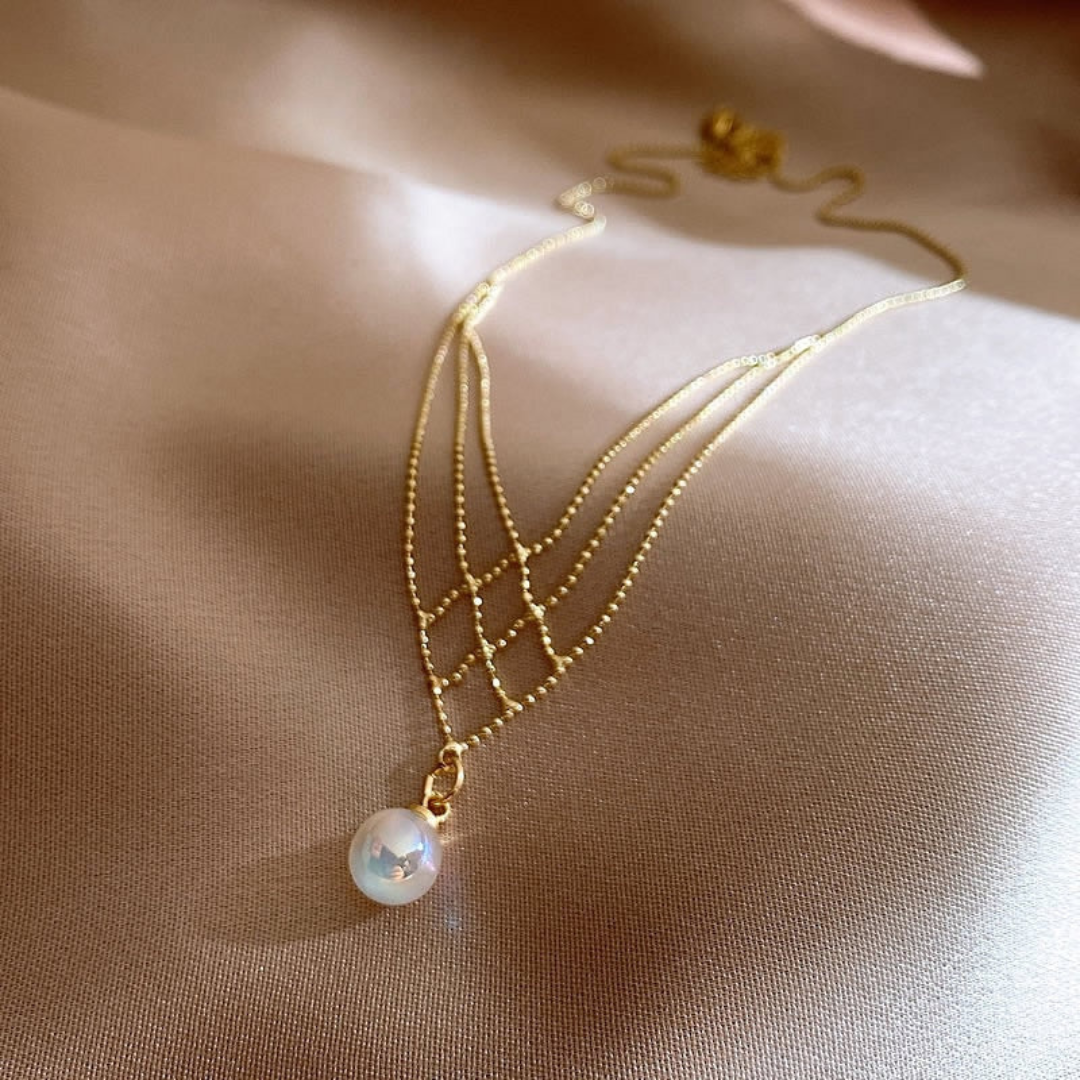 Women's elegant woven pearl necklace, a timeless fashion accessory for sophisticated style.