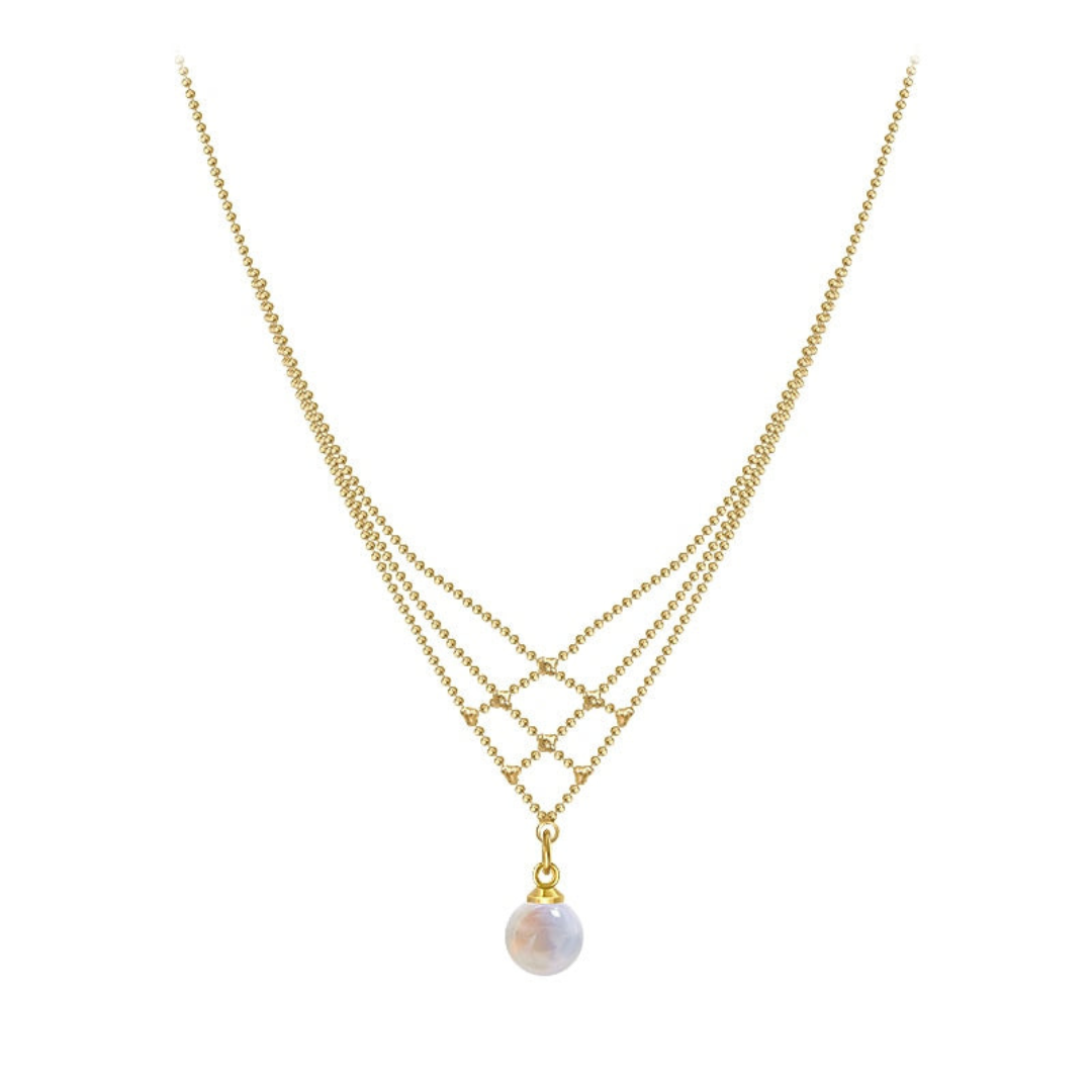 Stylish woman showcasing an elegant woven pearl necklace, enhancing her look with a timeless accessory.