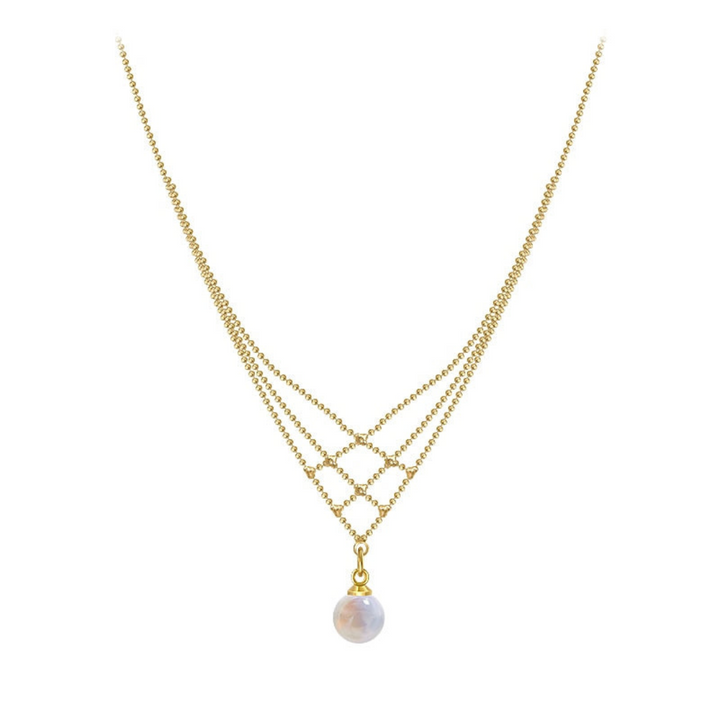 Stylish woman showcasing an elegant woven pearl necklace, enhancing her look with a timeless accessory.
