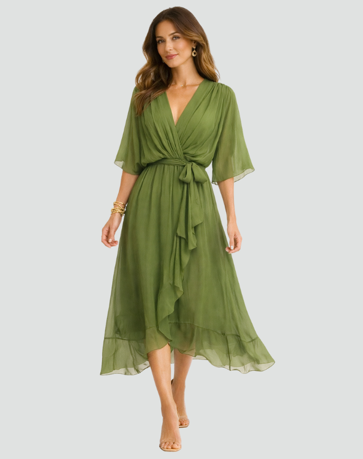 Flowy women's wrap midi dress featuring a V-neck & tie waist. Elegant and versatile for any event.