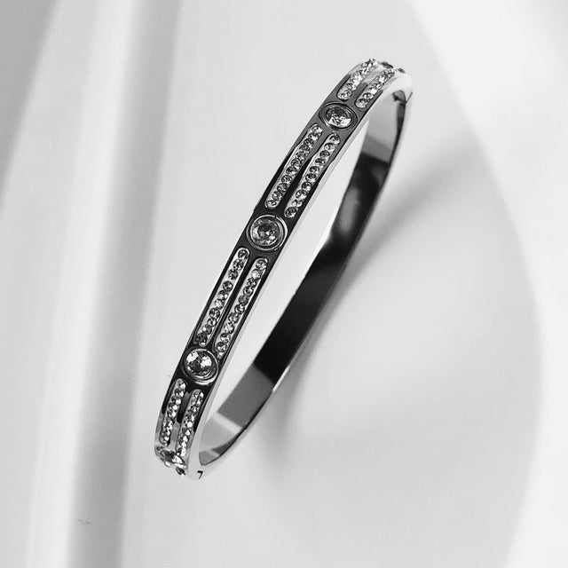 Women's stunning zircon inlay bangle, an elegant waterproof accessory for her.