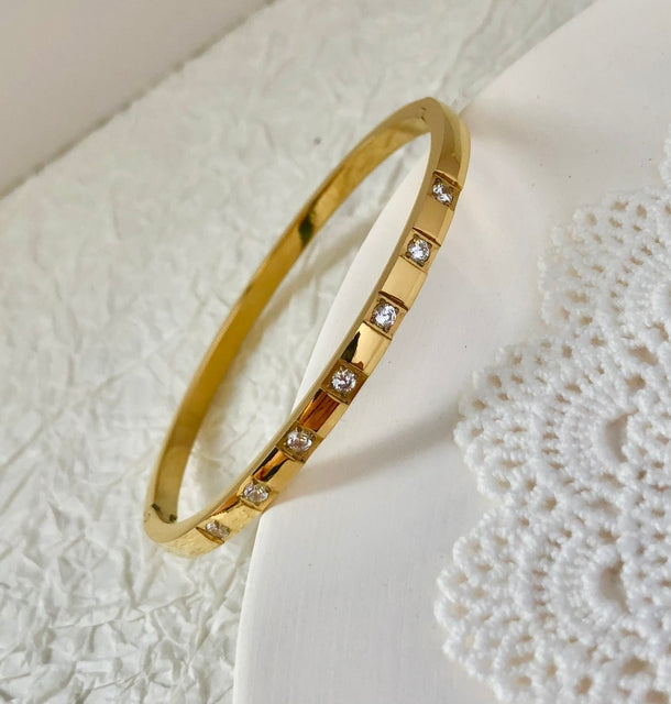 Chic women's waterproof zircon inlay bangle bracelet, perfect for gifting.