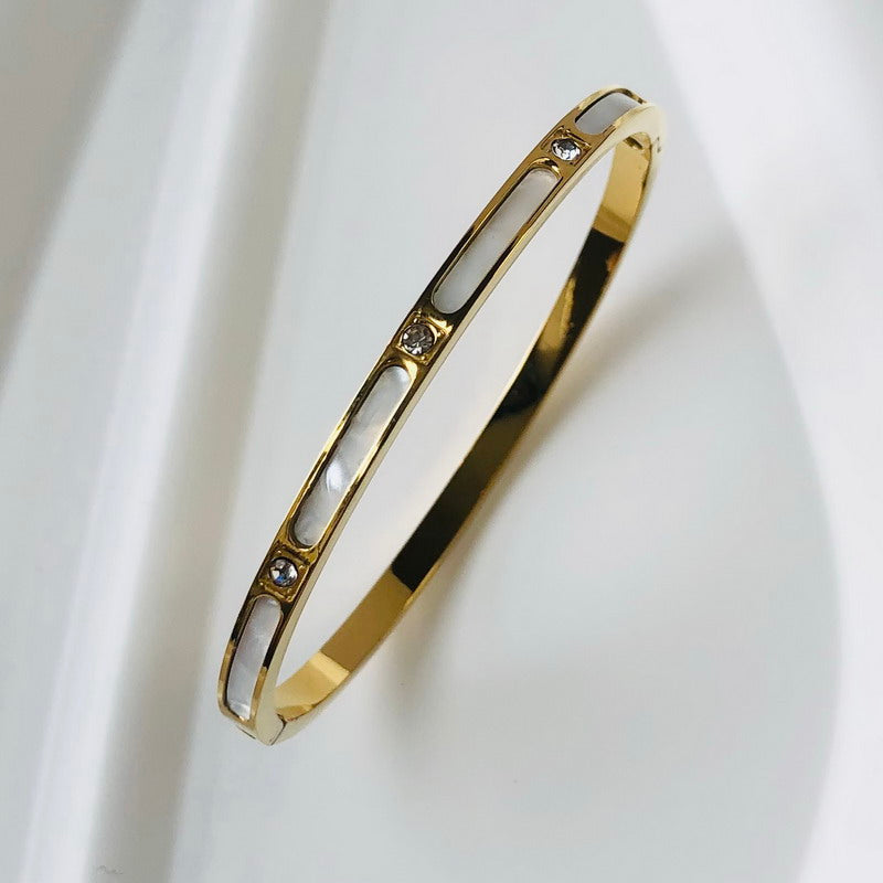 Timeless women's zircon inlay bangle, an elegant sparkling jewelry piece.