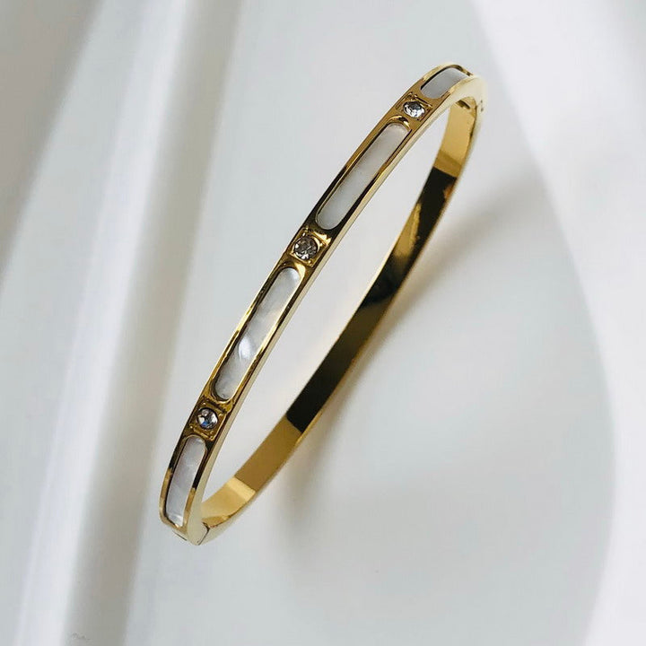 Timeless women's zircon inlay bangle, an elegant sparkling jewelry piece.