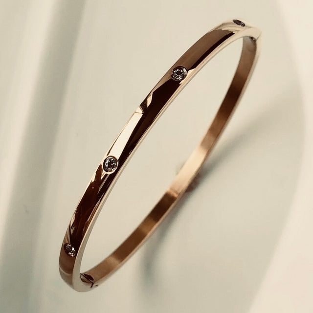 Chic women's accessory: waterproof zircon inlay bangle bracelet.