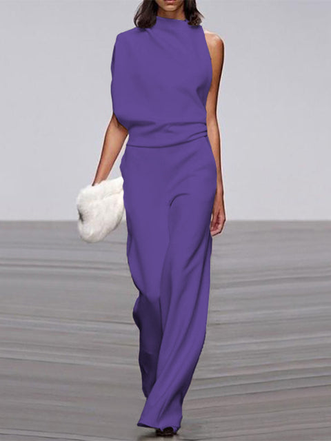 Woman walking in a comfortable & flowy Ella summer dress. Versatile day dress for casual elegance.