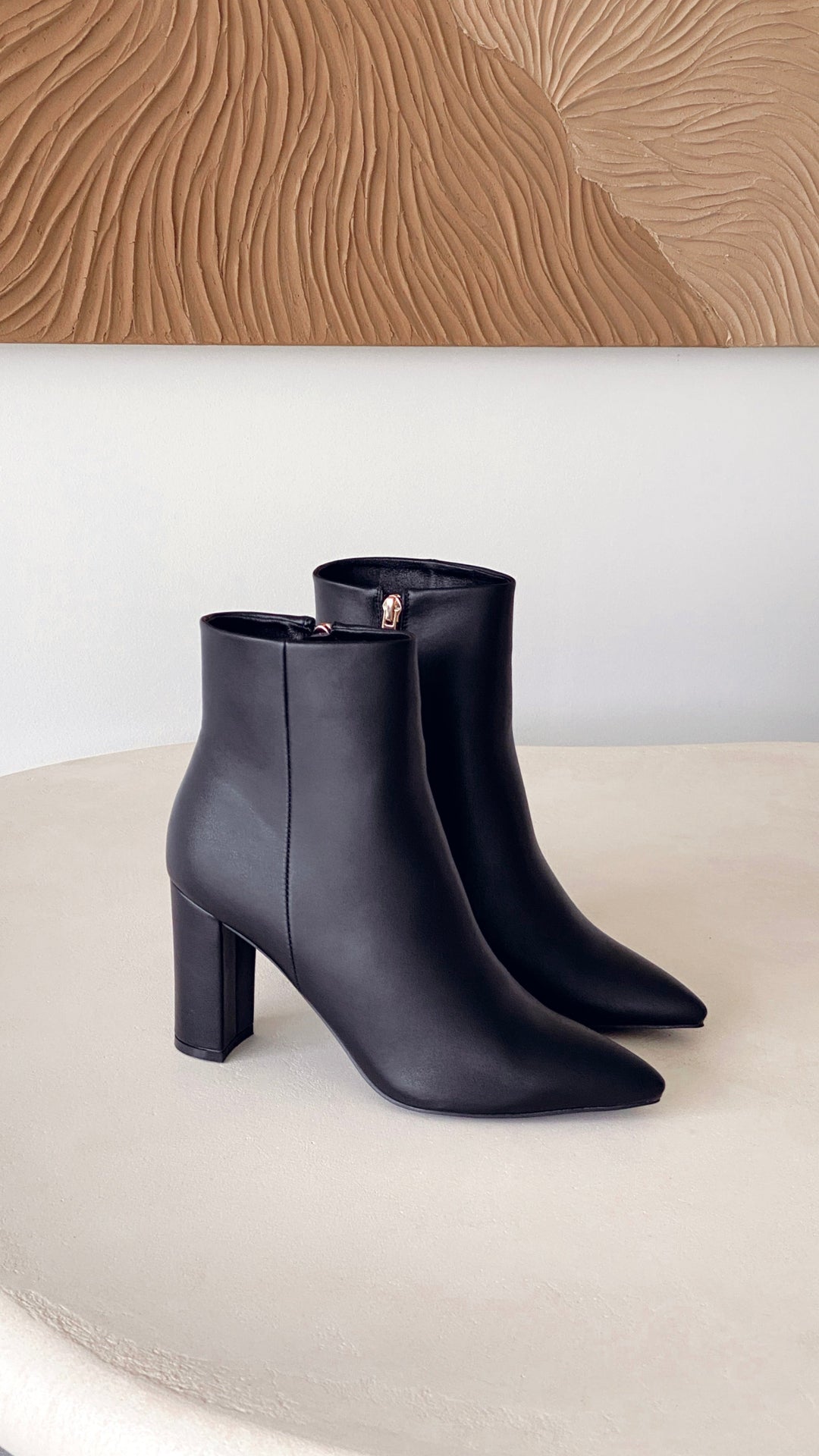 Chic ladies casual ankle boots with a versatile block heel and sleek pointed toe silhouette.