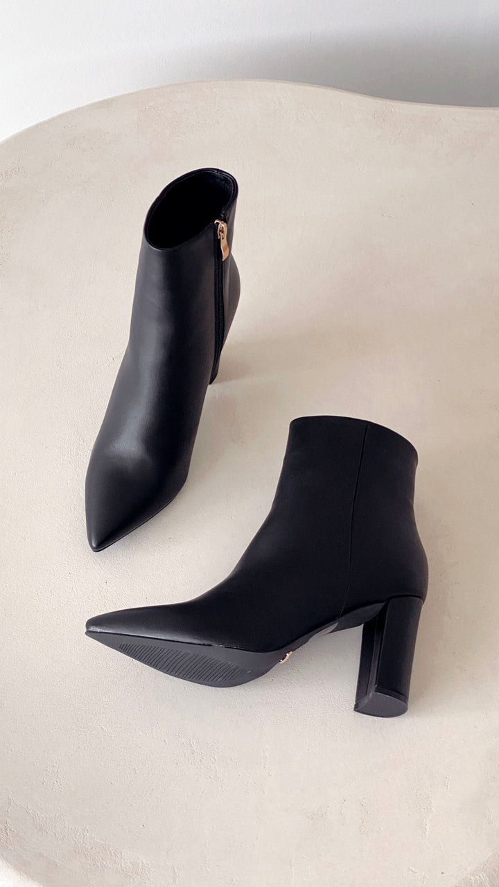 Full view of women's trendy Elonette ankle boots, highlighting the block heel and pointed toe.