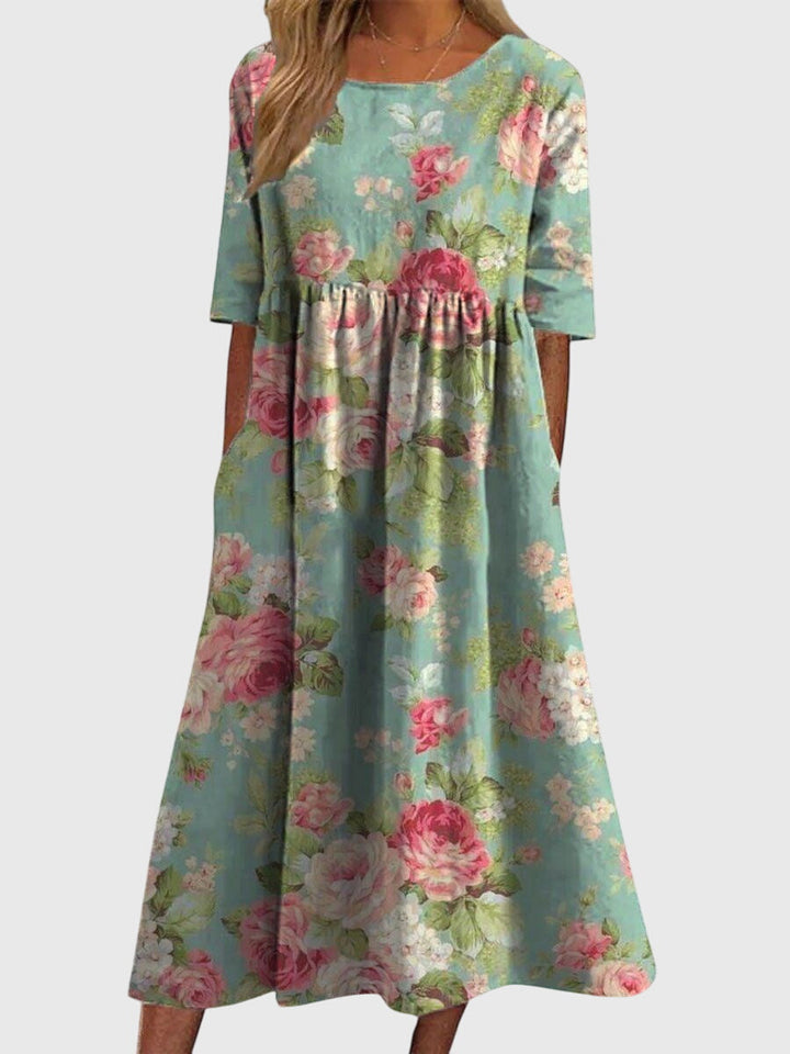 Flattering women's midi dress with intricate embroidery, a versatile flowy design for any occasion.