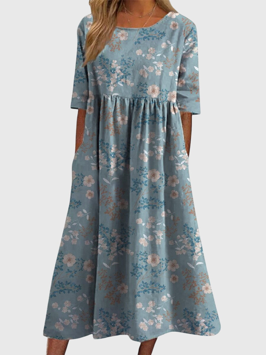 Close-up of the delicate embroidery on a women's flowy multi-color midi dress, enhancing its charm.