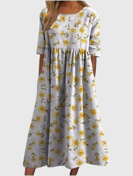 Full length shot of a women's embroidered midi dress, highlighting its versatile flowy multi-color design.