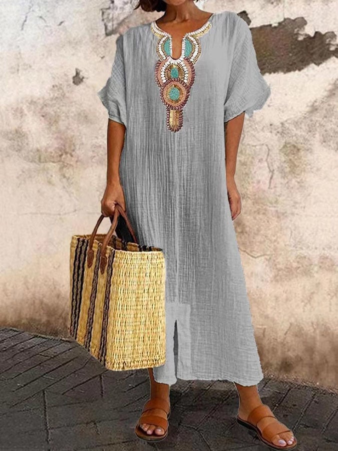 Flowy women's kaftan maxi dress with delicate embroidery. Perfect for relaxed summer days, beach, or casual elegant wear.