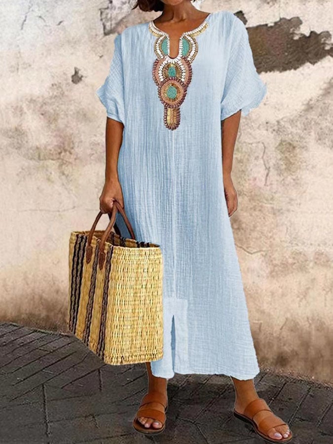 Long embroidered kaftan maxi dress for women. Breezy summer style, ideal beach wear, or elegant holiday outfit. Relaxed fit.