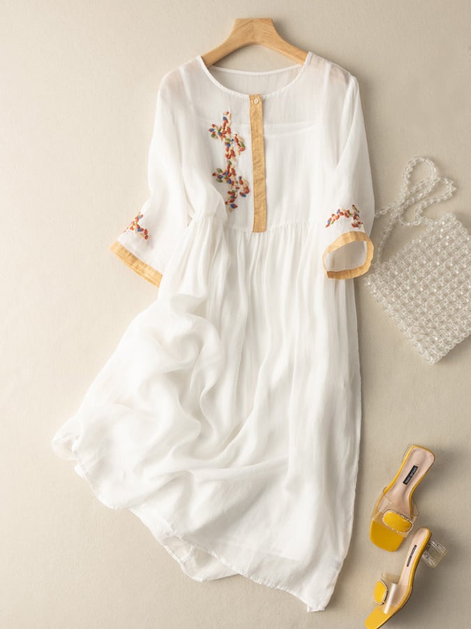 Boho style women's embroidered flared dress. Features a round neck & mid-sleeves for a relaxed look.