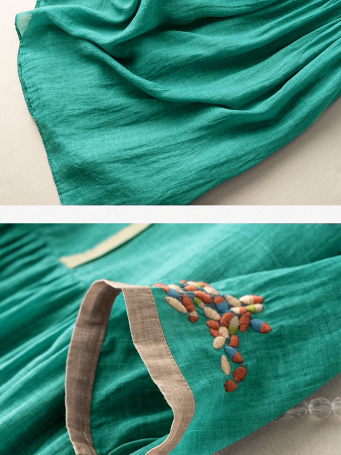Back view of women's embroidered loose fit boho dress. Comfortable, versatile, round neck, mid-sleeve design.