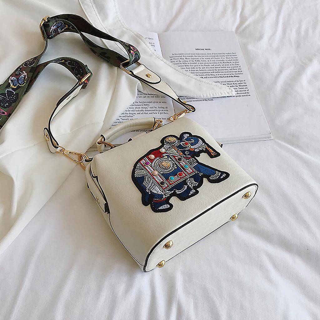 Side view of the embroidered mandala shoulder bag, showcasing its slim profile and lightweight design