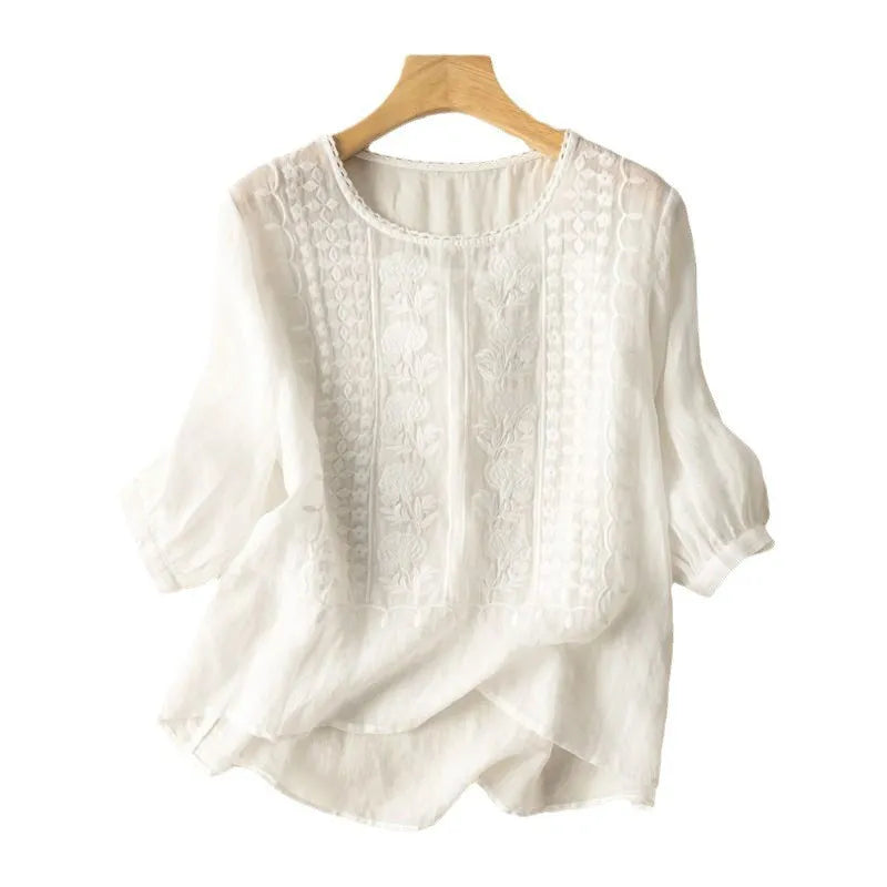 Women's embroidered puff sleeve blouse, elegant floral design, flowy and stylish for casual wear.