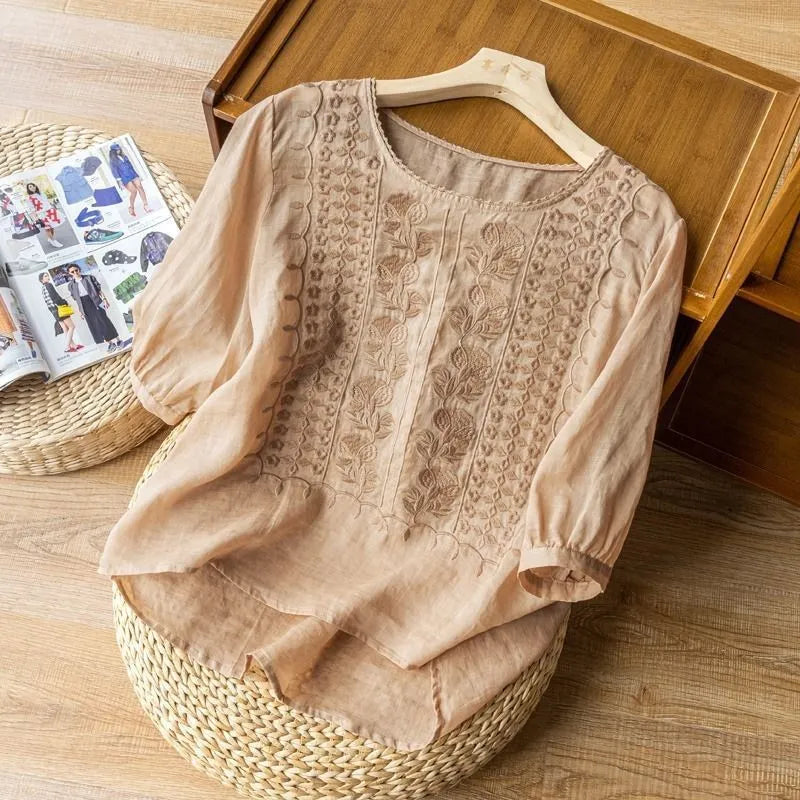 Chic women's flowy blouse with stylish puff sleeves and beautiful floral embroidery. Casual elegant top.