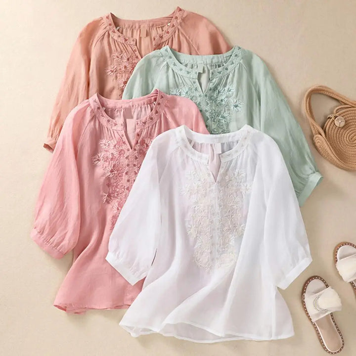 Women's embroidered summer blouse with delicate floral design, loose fit, perfect for casual wear or vacation.