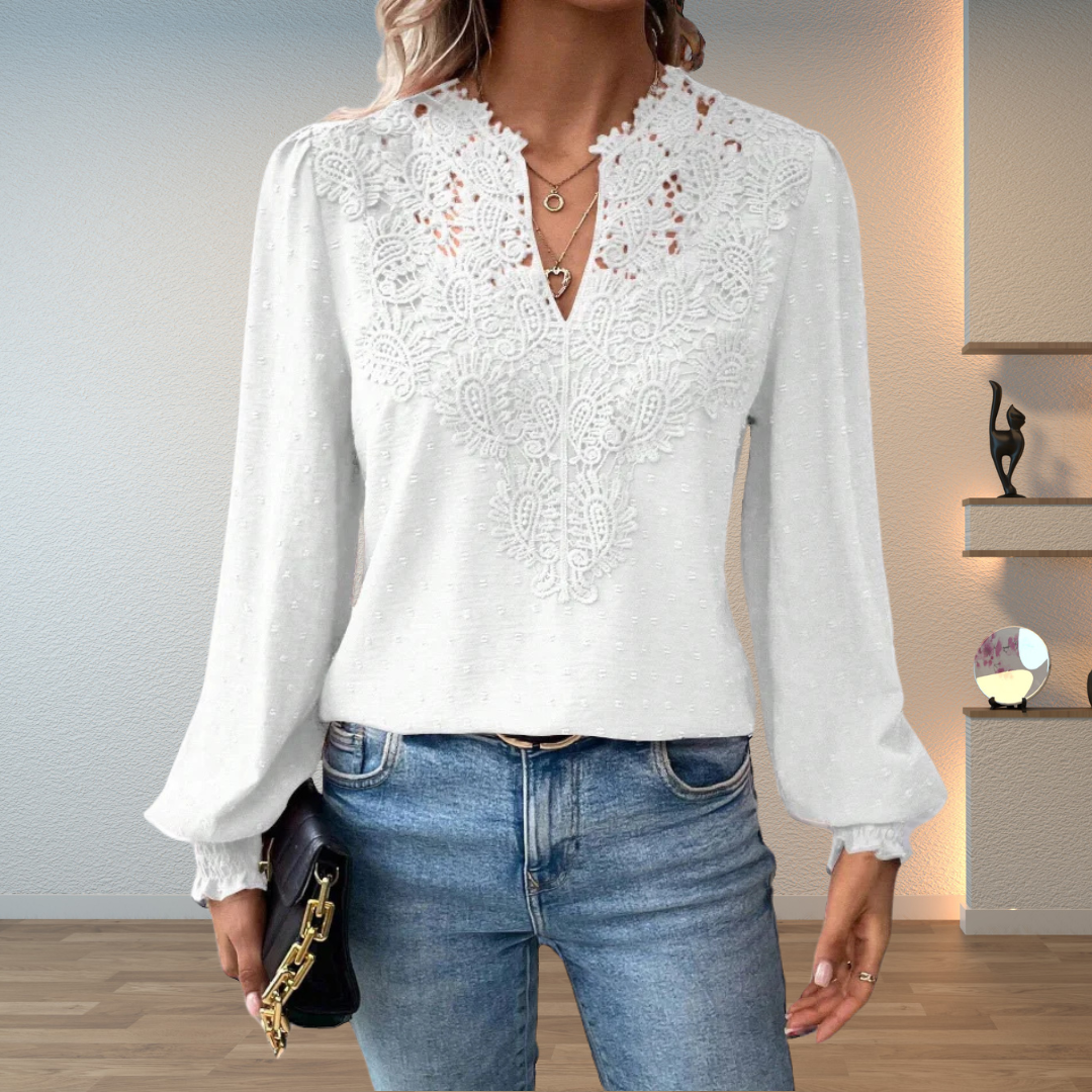 Sophisticated women's embroidered top with a flattering V-neck and long sleeves.