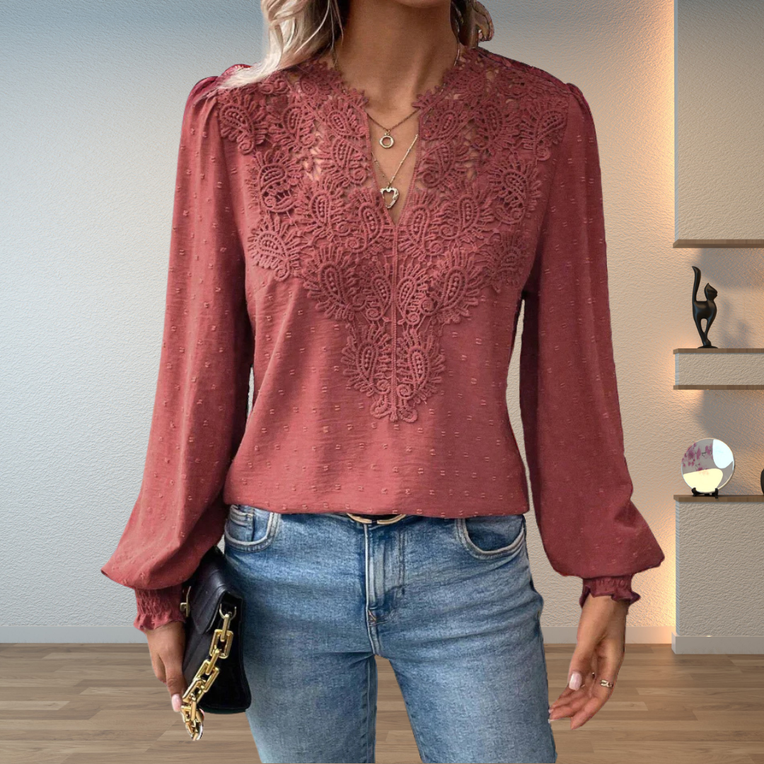 Casual chic women's blouse featuring V-neck, long sleeves, and beautiful embroidery.