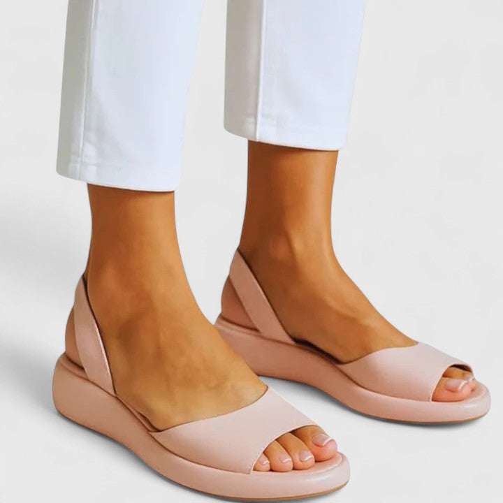 Emrynn women's orthopedic sandals, offering cushioned comfort, arch support & easy slip-on wear for summer.