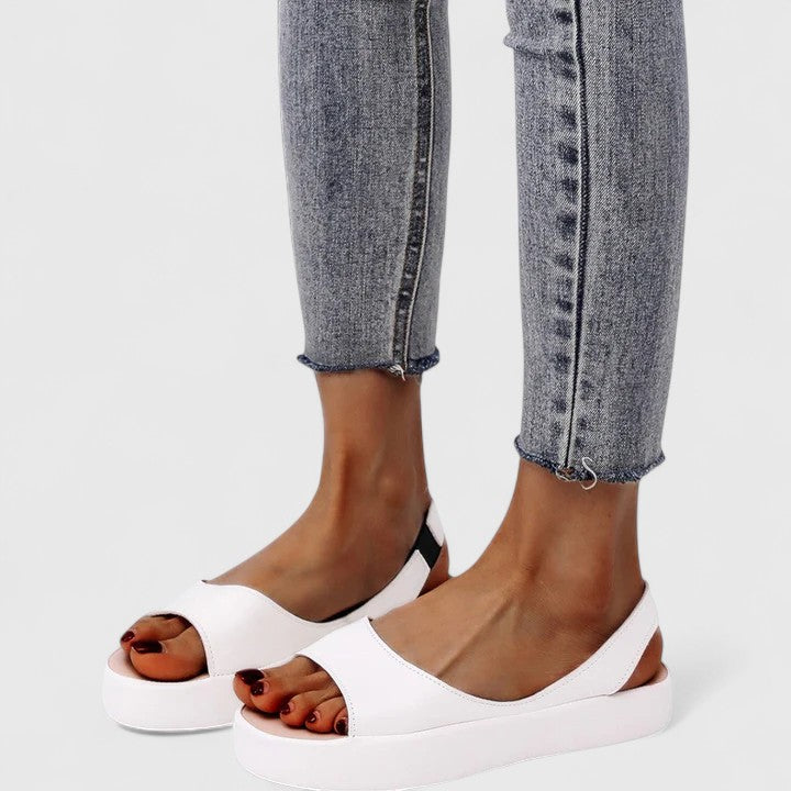 Women's Emrynn orthopedic slip-on sandals featuring advanced cushioning and arch support for ultimate comfort.