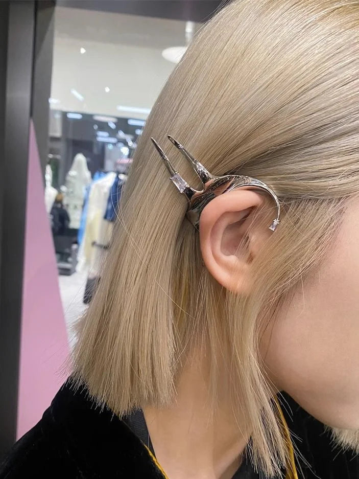Delicate sterling silver elf wing earrings. Unique women's fantasy jewelry with a mystical design.