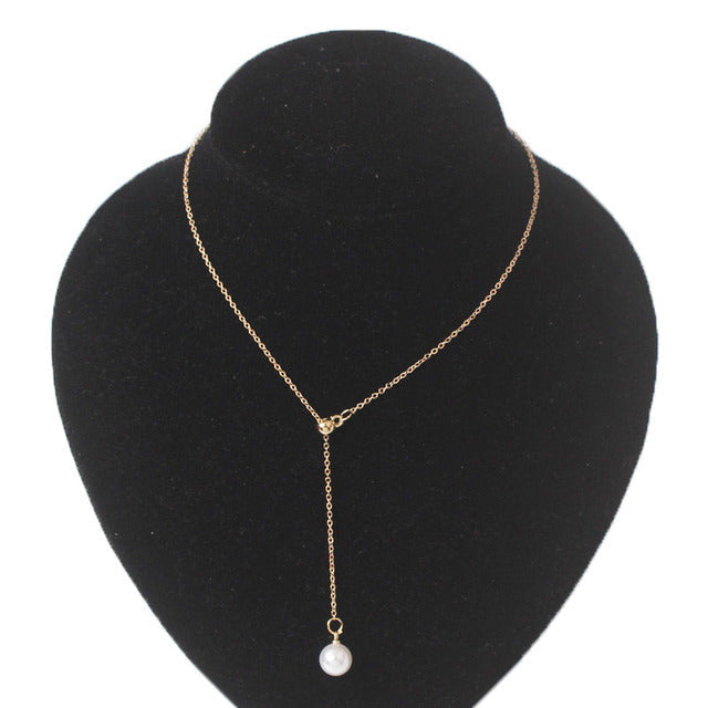Gold women's fairy necklace, enchanting pendant jewelry, perfect for a whimsical look.