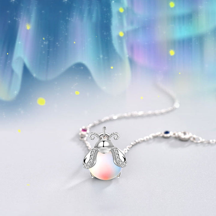Women's enchanting firefly moonstone necklace, delicate sterling silver pendant jewelry.